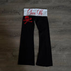 Scene Women's Black Wide-Leg Skull-and-Crossbones Graphic Pants