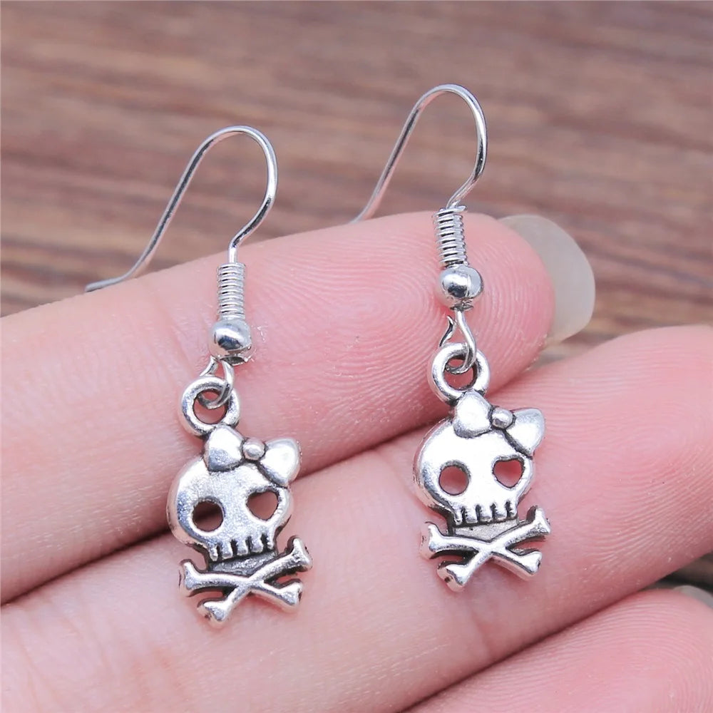 Scene Antique Silver Skull and Bow Drop Earrings